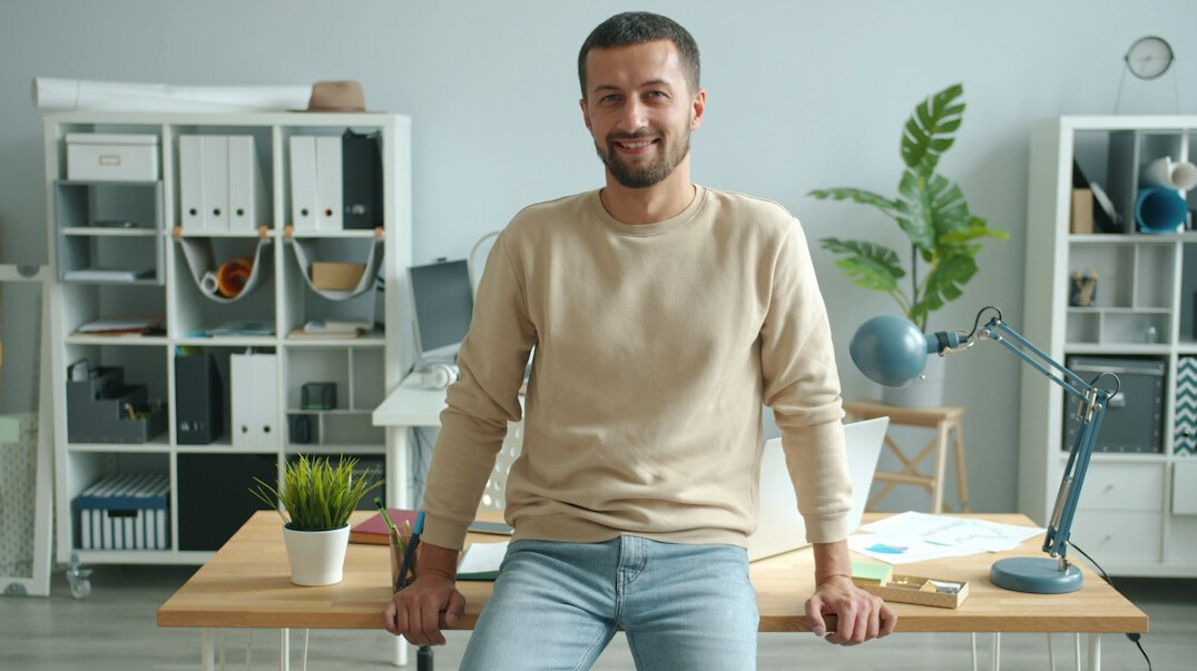 employee meditating at desk