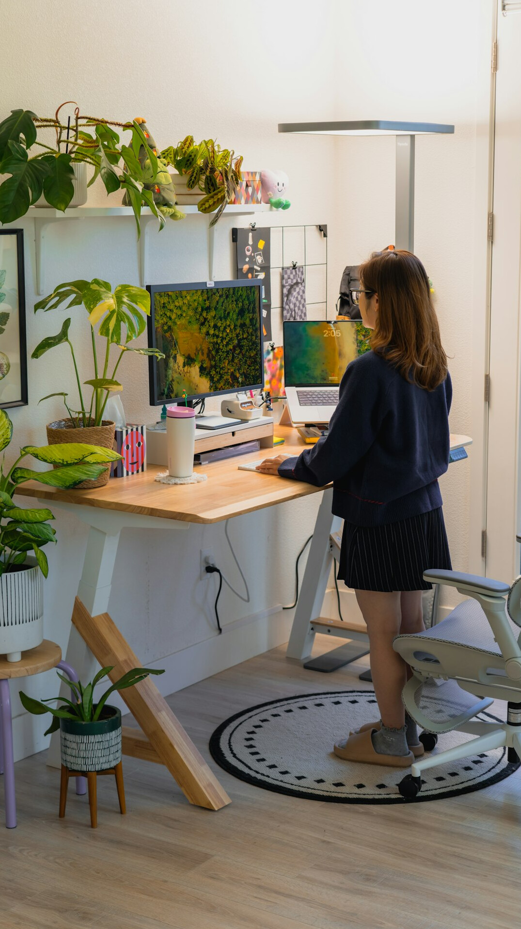 woman stretching back in office
