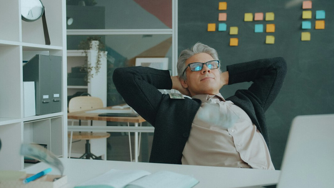 office worker stretching at desk